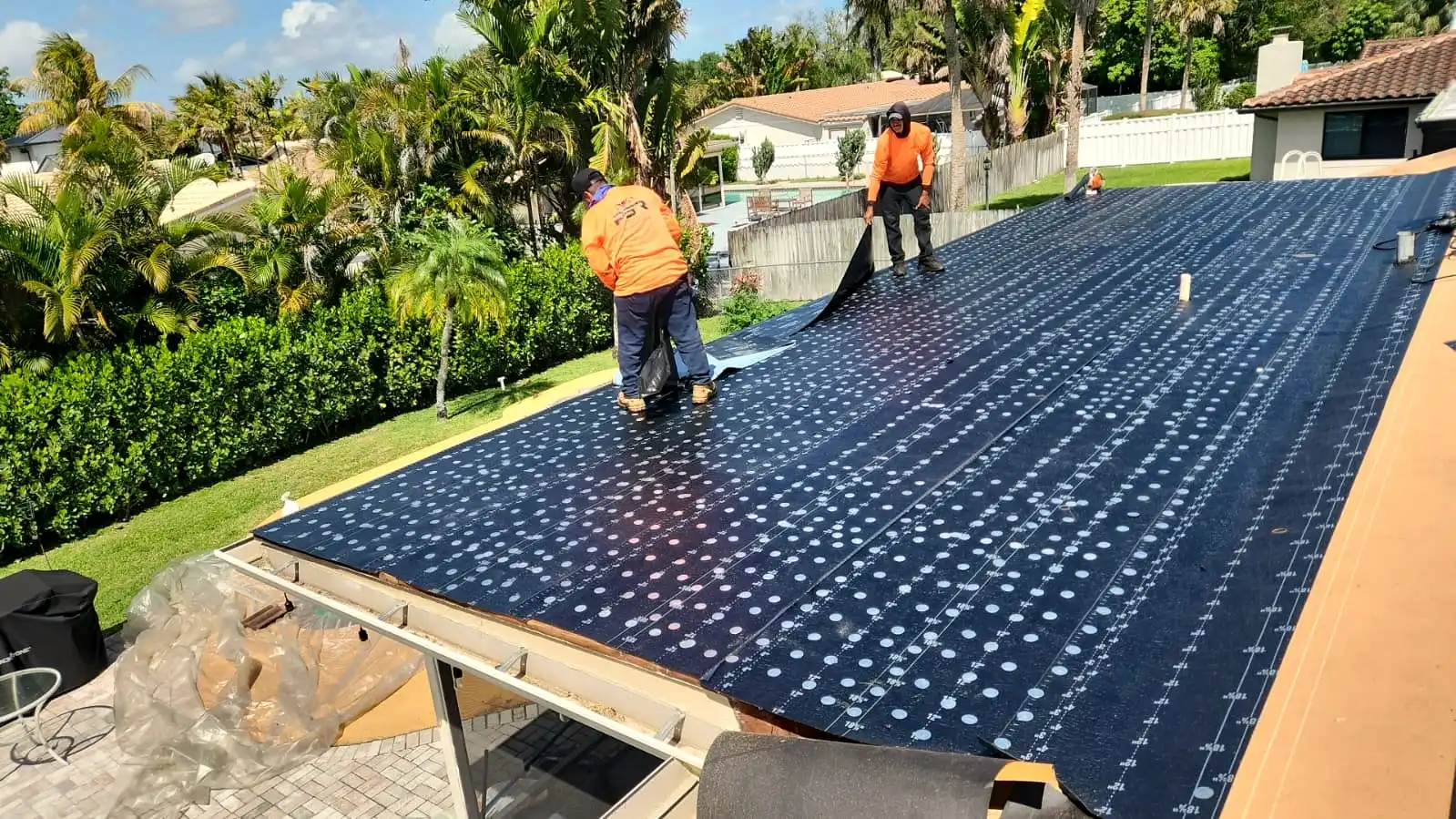 PSR crew working along the edge of a roof
